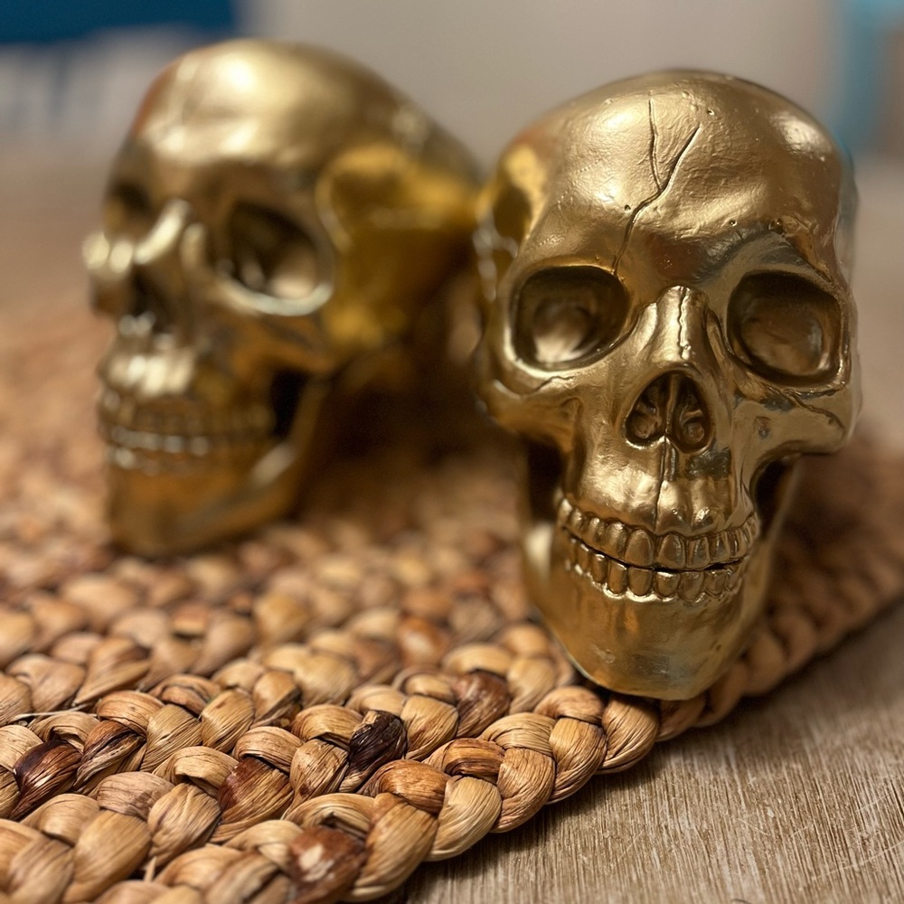 two gold skulls